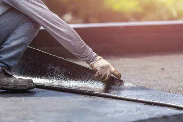 Professional Waterproofing technician working in Sheboygan Falls, WI